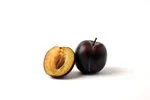 half sliced black plum in white background image