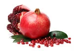 peeled half with one full pomegranate in white background