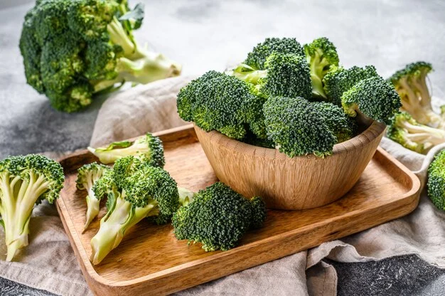 Broccoli on a wooden bowl